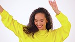 Happy, dance and woman moving in a studio while listening to music with a casual, cool and stylish sweater. Happiness, smile and female model dancing to a playlist, song or album by white background.