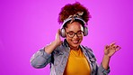 Dance, happy and woman with headphones for music isolated on a pink background in a studio. Smile, fun and girl listening to an audio, radio or playlist while dancing on a backdrop for happiness