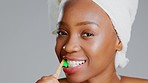 Face, black woman and toothbrush for dental hygiene, smile and girl against a grey studio background. Portrait, African American female and lady with oral health, cleaning mouth and fresh breath.