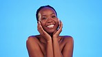 Face, black woman and skincare for shine, beauty and wellness against blue studio background. Portrait, African American female and lady with happiness, confidence and body care for glow or soft skin