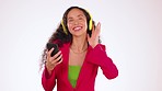 Black woman with smartphone, listening to music with headphones and dancing isolated on studio background. Fun, rhythm and dance with young female, mockup space and freedom with technology and radio