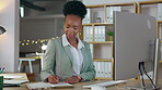 Black woman, writing and planning business at night on computer and notebook for schedule reminder at office. African American female employee working late taking notes in book for project plan by PC