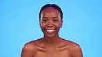 Skincare, face and black woman in studio, smile and wellness, hygiene and body care on blue background. Beauty, portrait and happy girl model relax with luxury, glow and cosmetics while isolated 