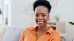 Black woman, face and smile on sofa in home living room with comic laugh, relax or peace in morning, Girl, lounge couch and happiness in portrait in house for me time, freedom or sitting in apartment