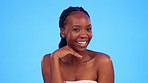 Skincare, black woman and hands on face in studio for wellness, hygiene and body care on blue background. Beauty, portrait and girl model relax with luxury, glow and facial cosmetics while isolated 