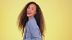 Natural, hair and face of black woman in studio happy, playful and having fun against yellow background. Crazy, afro and portrait of girl excited, energetic and carefree, happy and smile while posing