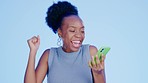 Black woman, texting and phone in studio for smile, nft winning or online casino with fashion by blue background. Gen z girl, smartphone or celebration for winner, crypto or esports goals by backdrop