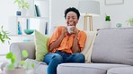 Relax, black woman on couch and coffee on break, smile and cheerful in living room. African American female, lady and tea for peace, sofa and happiness with quality time, natural aroma and gratitude