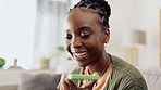 Laptop, phone call and black woman talking on a sofa while working on a freelance project. Voice recognition, cellphone and African female freelancer on mobile conversation doing research on computer