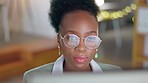Glasses, business and face of black woman on laptop working on research, online documents and report. Corporate, technology and female worker typing on computer for strategy, planning and internet