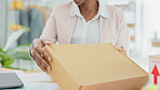 Black woman, laptop and hands with box in logistics for ecommerce, delivery or shipping cargo at office desk. Hand of African American female working on computer in small business for online purchase