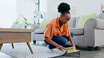 Sweeping, cleaning and black woman in home living room to remove dust or dirt on floor for health and wellness. Service, maid and female housekeeper or cleaner with chores for hygiene maintenance.