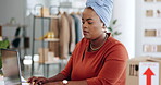Black woman, laptop and typing in logistics for schedule delivery, order or ecommerce in fashion business. African American female working on computer in digital marketing for shipping information