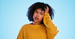 Face, confused and thinking by black woman in studio, pensive and wondering on blue background. Doubt, portrait and unsure girl with decision, choice or emoji on mockup, product placement or isolated