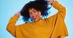 Happy black woman, dance and beauty in studio by blue background for fashion, smile or wellness. Young gen z student, dancing and freedom with yellow clothes, curly hair afro and fitness by backdrop