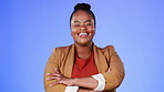 Portrait, laughing and a business black woman in studio on a blue background standing arms crossed feeling confident. Comic, comedy and confidence with a female employee enjoying a funny joke