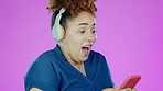 Woman headphones, surprise and phone win results of a young African female in a studio. Isolated, pink background and wow of a person with happy mobile news from online lottery notification and bonus