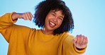 Black woman, face and dance with fun and happiness, positive energy and rhythm on blue background. Happy female dancer, freedom and dancing in studio, crazy and carefree, mockup and joy in portrait