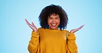 Happy, dancing and face of a woman in a studio for celebration, success and achievement. Happiness, smile and portrait of female model with energy and freedom dance for excitement by blue background.