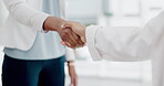 Business people, handshake and partnership for b2b, meeting or trust in teamwork at the office. Colleagues shaking hands in unity, deal or agreement for greeting, welcome or introduction at workplace