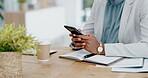 Black woman, hands and phone chatting in business for communication, social media or texting on office desk. Hand of African American female typing on smartphone or mobile app for research or chat