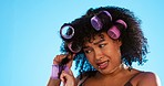 Black woman, studio and hair styling curlers by background with struggle for beauty, self care and aesthetic. Frustrated gen z model, african girl and hairstyle with problem, plastic mould and pain