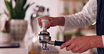 Hands, barista and coffee maker with an employee working behind a kitchen counter in a cafe for service. Waiter, cafeteria and caffeine with a person making a drink at work in a restaurant