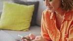 Asian woman, hands and typing on smartphone for connection, social media post and reading notification. Happy female, mobile chat and technology app on internet, website and digital network at home