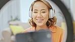 Media, podcast and smile, asian woman streaming or recording or broadcast from home studio in living room. Video, webinar and microphone, happy influencer networking on live stream internet channel