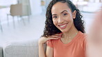 Black woman, face and smile for selfie, vlog or profile picture relaxing on living room sofa at home. Happy African American female smiling for photo or social media post chilling on lounge couch