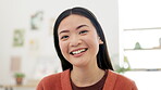 Face, funny and Asian woman laughing feeling happy and excited or confident in an office with a business mindset. Portrait, happiness and young female employee or worker with confidence