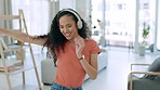 Living room dance, happiness and woman with headphones at home feeling freedom and a smile. House, happy female dancing and web song audio with energy listening and streaming music by a sofa 