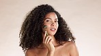 Face, jade roller and black woman in studio for skincare, circulation and treatment on brown background. Portrait, facial massage and beauty product for wellness model relax with luxury tool isolated