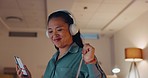 Woman, music and dance in night office with happiness, motivation and excited mindset of late shift. Happy worker dancing with headphones, mobile and evening of business success, inspiration or smile