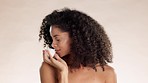 Skincare, face cream and black woman smelling product in studio on brown background. Portrait, container and beauty product scent by happy model with sunscreen, facial or mask, fragrance and isolated