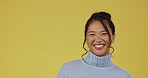 Asian woman, smile and portrait while pointing hands in studio on a green background isolated space. Female model person happy with product placement, marketing or funny announcement on color