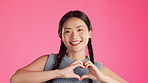 Asian woman, happy or face and heart hands in dancing support, wellness or skincare product vote on isolated studio background. Smile, dancer or portrait in love fingers, emoji shape or fashion sign