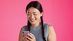 Laugh, phone and text message with asian woman in studio for connection, funny and typing. Browsing, comedy and app with girl and reading online for social media, website and technology on background