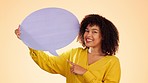 Speech bubble, face smile and woman pointing in studio isolated on a brown background. Social media, mockup and female with poster for voice, opinion or advertising, marketing or product placement.