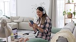 Dance, headphones and woman on couch, smartphone and movement with wellness, relax and calm. Female, lady and cellphone with headset, streaming music and listening to sounds, audio and in living room