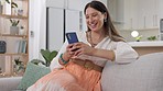 Woman, smartphone and laughing on couch, lounge and reading funny social media post, online chat and meme. Happy female typing on cellphone in house, smile and mobile download with technology