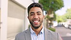 Happy, smile and face of a businessman in the city on a walk in the street to his work building. Happiness, laughing and portrait of a professional male employee with a positive mindset in town road.