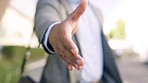 Closeup hand, handshake and businessman in a city for b2b meeting, startup and welcome on blurred background. Greeting, man and shaking hands gesture outdoors for integration, partnership and deal