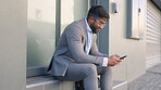 Phone, commute and a business man in the city, typing a text message while taking a break from work. Contact, texting and 5g mobile technology with a male employee sitting on a step in town