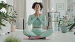 Yoga, woman and home fitness of a young mixed race female doing exercise and meditation. Mindfulness, zen and peace workout with pilates in a house with a person doing a spiritual sport to relax