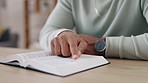 Closeup, hands and man reading bible, guidance and faith for wellness, health and motivation. Zoom, holy book and scripture for teachings, learning and knowledge for analysis, information and belief