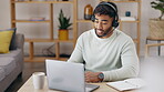 Video call, work from home and man in virtual communication, discussion or online meeting on laptop. Young person or remote worker on computer in living room for career, project or job conversation