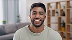 Happy, smile and face of a man in his living room with a positive, good and confident mindset. Happiness, excited and portrait of a male freelancer from India sitting in his lounge at his modern home