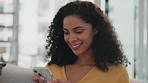 Woman smile, phone and text on a living room sofa feeling happy on a work break with mobile. Home, networking website notification and social media scroll of a young person on web communication app