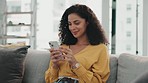 Woman, phone and mobile text on a living room sofa feeling happy on. a work break with mobile. Happy, networking notification and social media scroll of a young person on web communication app